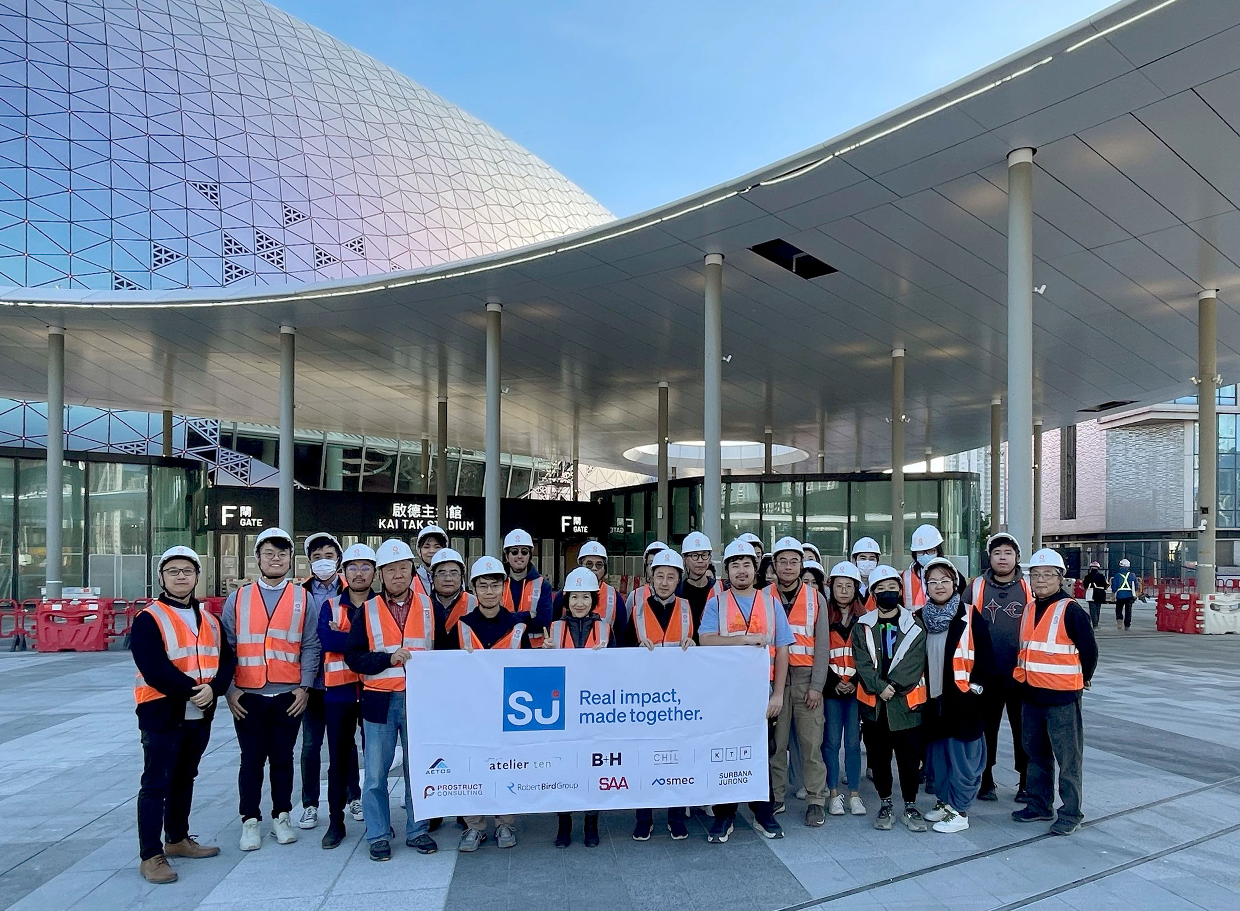 Team in front of the Kai Tak sports park