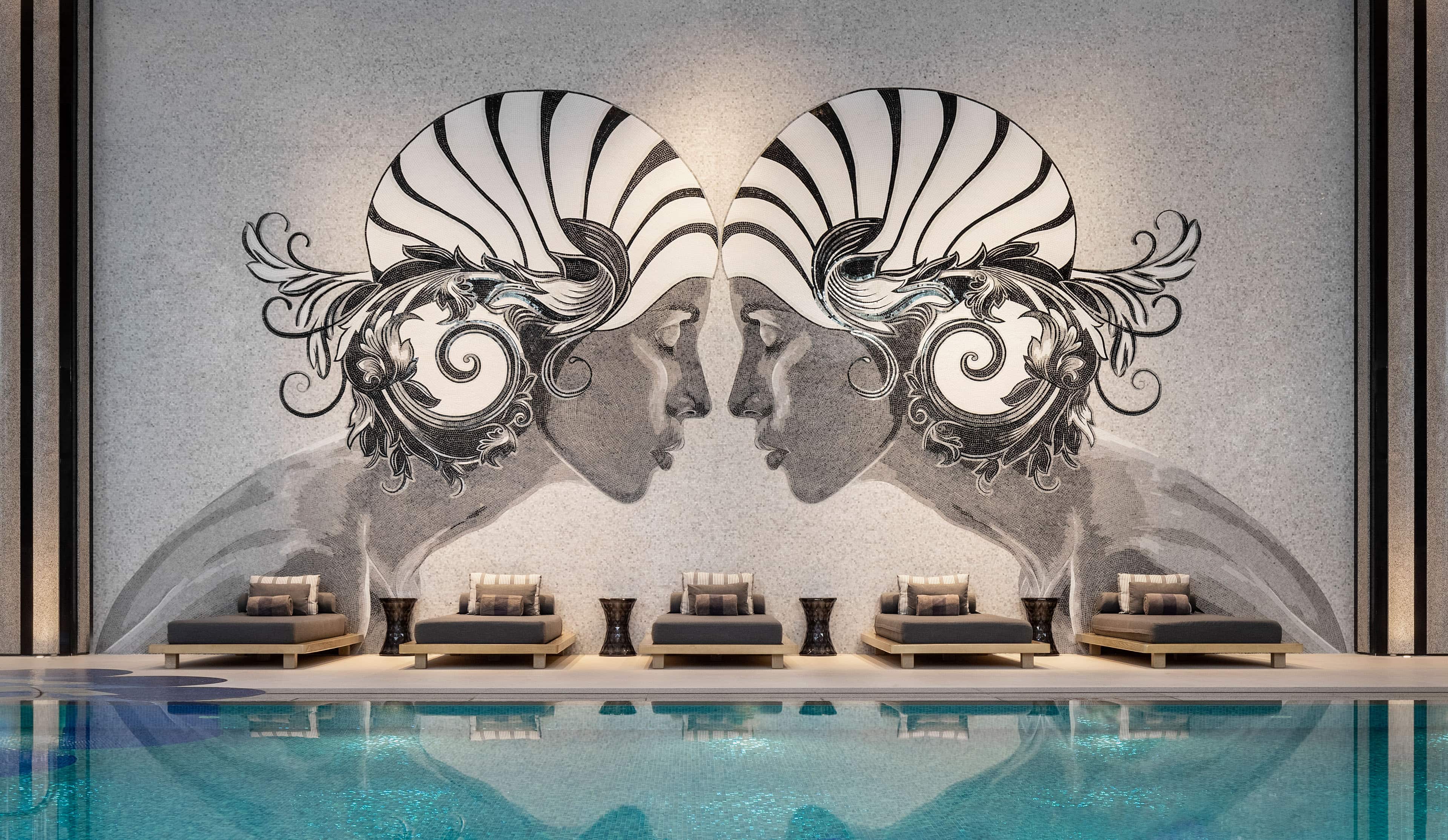 Indoor pool under large mosaic mural